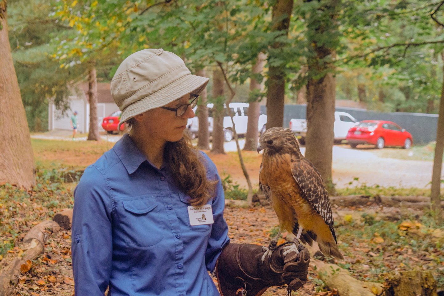 woman holding red hawk